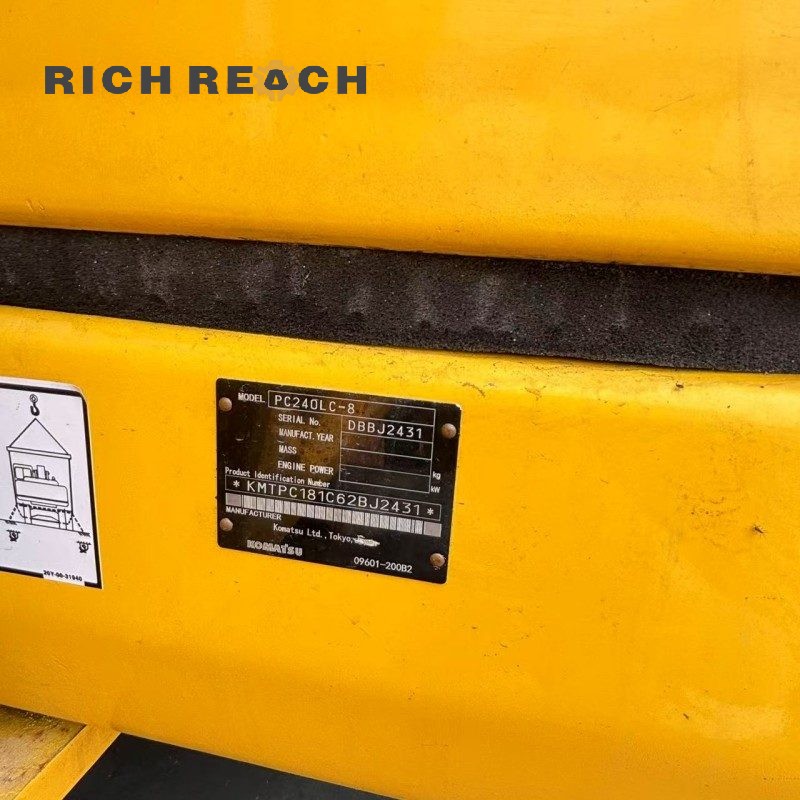Side profile of a 2018 Komatsu PC240LC excavator showing the boom and arm, $34,722